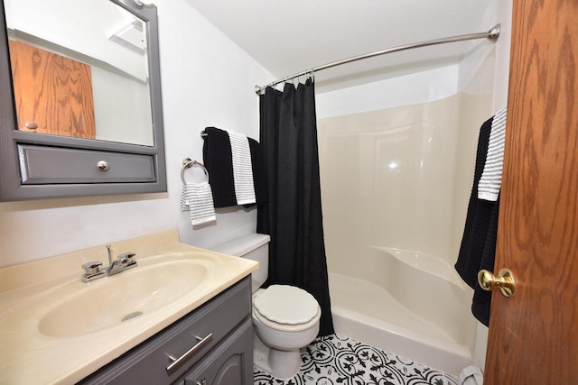 bathroom with tile patterned flooring, a shower with curtain, vanity, and toilet