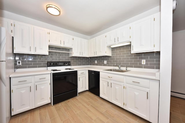 kitchen with decorative backsplash, white appliances, white cabinetry, and sink