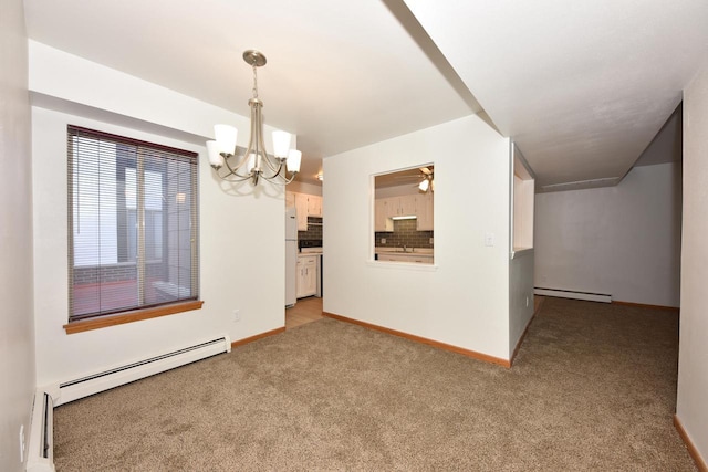 carpeted spare room featuring ceiling fan with notable chandelier and a baseboard heating unit