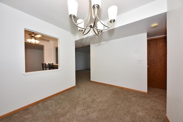 empty room with carpet and ceiling fan with notable chandelier