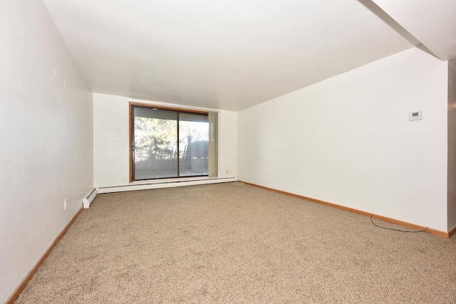 empty room featuring carpet and a baseboard radiator