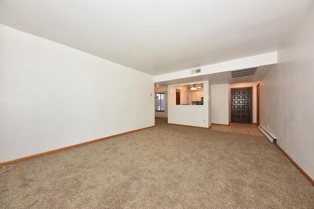 unfurnished living room with carpet floors and a baseboard heating unit