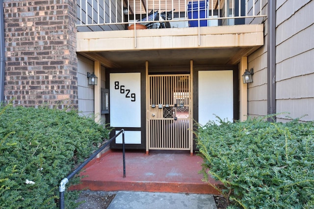 entrance to property with a balcony