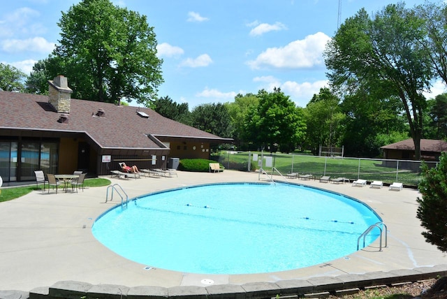 view of swimming pool with a patio