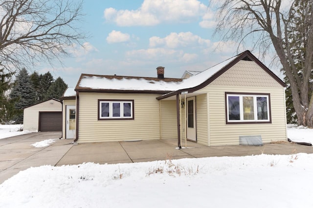 view of front of property with an outbuilding and a garage