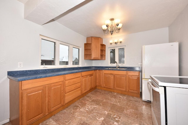 kitchen featuring white range with electric cooktop, sink, and a textured ceiling