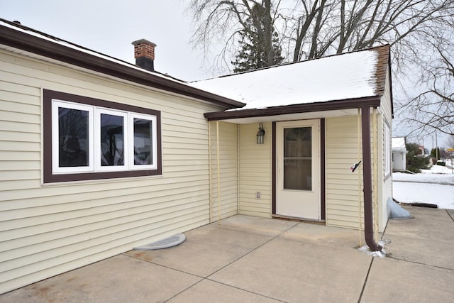 entrance to property featuring a patio area