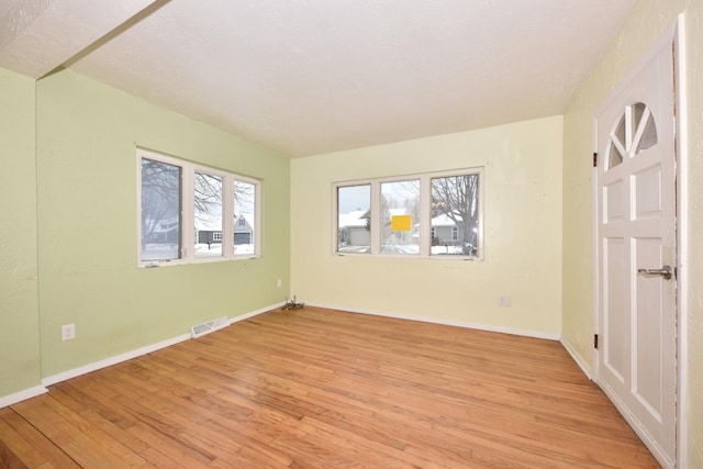 unfurnished room featuring light wood-type flooring