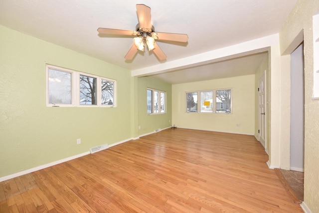 spare room with ceiling fan and light hardwood / wood-style flooring