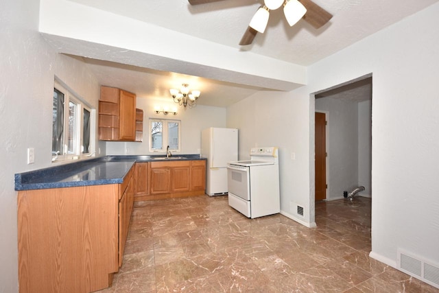 kitchen with ceiling fan, white appliances, and sink