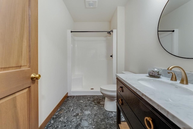 bathroom with vanity, toilet, and walk in shower