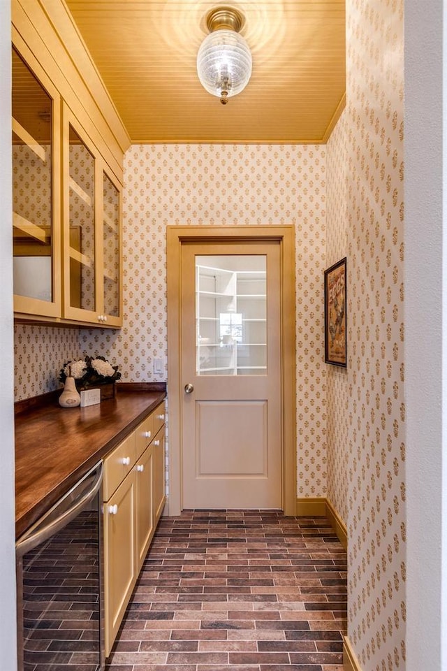 kitchen featuring wine cooler and crown molding