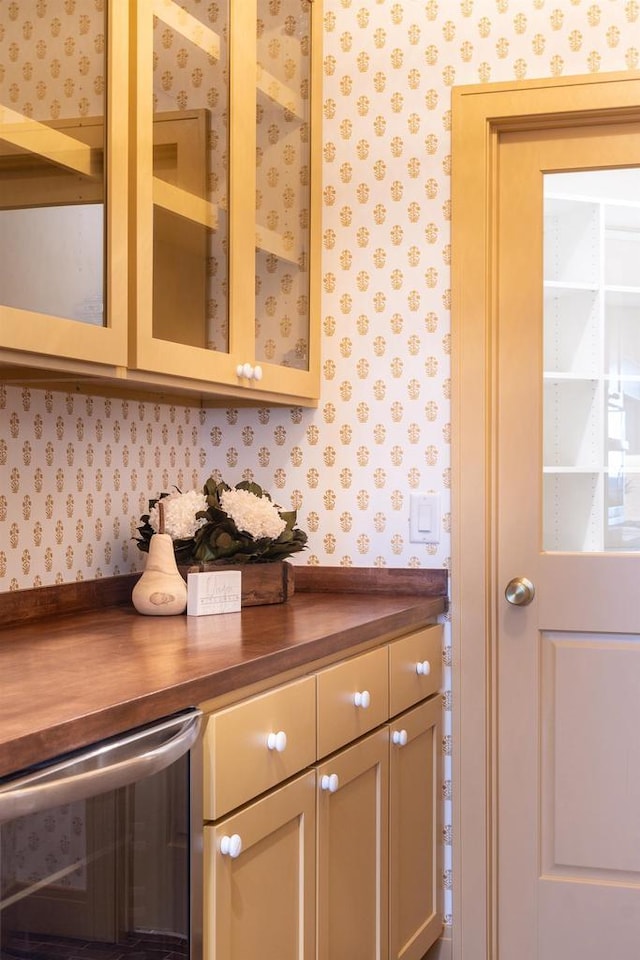 kitchen with butcher block counters and wine cooler