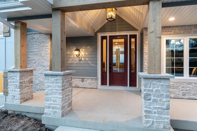 entrance to property featuring a porch