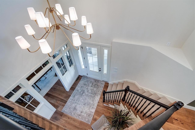 foyer featuring dark hardwood / wood-style flooring and an inviting chandelier