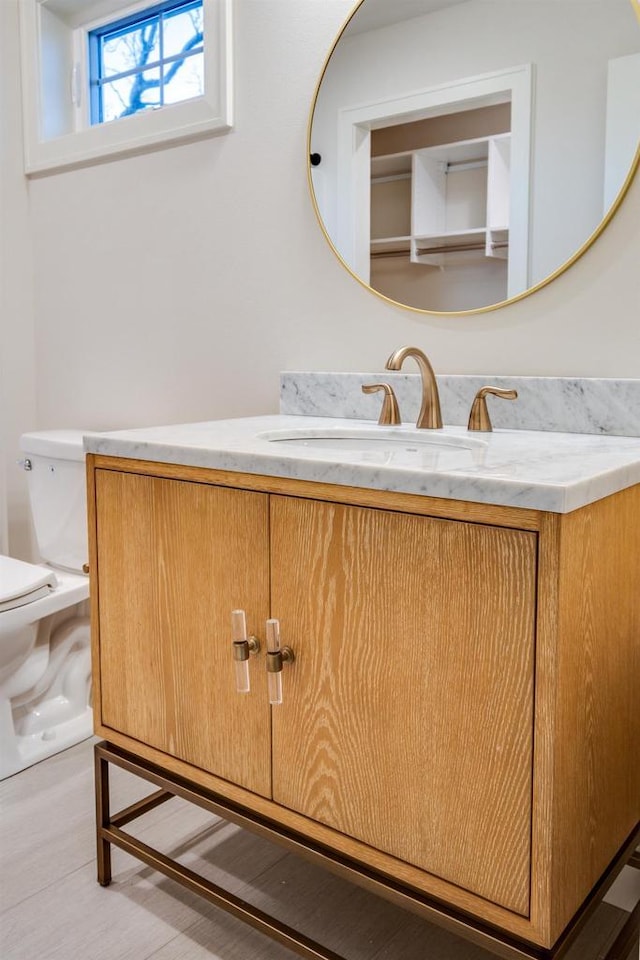 bathroom with vanity and toilet