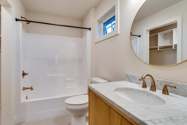 full bathroom with shower / tub combination, vanity, and toilet