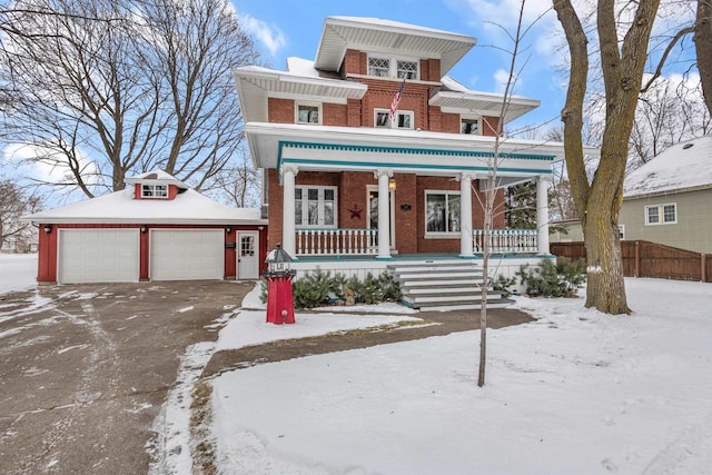 view of front of house with covered porch, an outdoor structure, and a garage