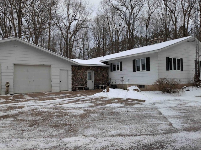 single story home featuring a garage