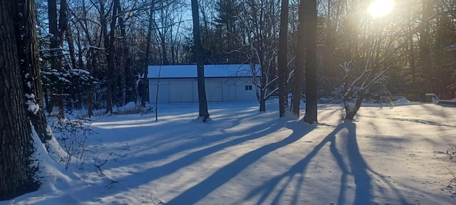 view of yard layered in snow