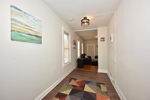 hall with dark hardwood / wood-style floors