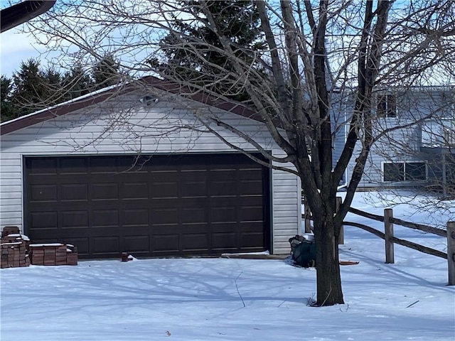 view of snow covered garage