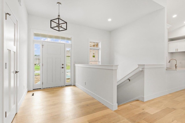 entryway featuring light hardwood / wood-style floors and sink