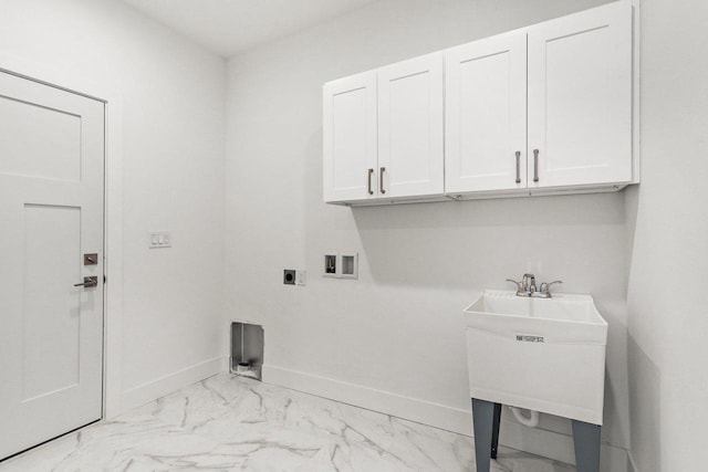 laundry room featuring electric dryer hookup, cabinets, sink, and hookup for a washing machine