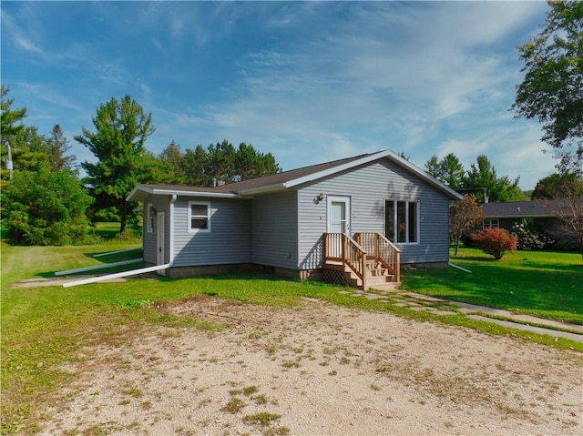 back of house with a yard