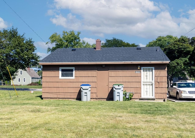 view of outdoor structure featuring a lawn