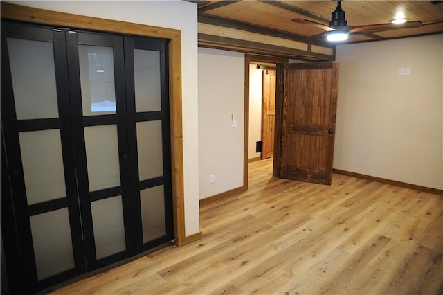 interior space with ceiling fan and light wood-type flooring