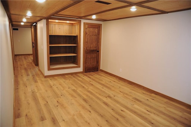 unfurnished room featuring light hardwood / wood-style floors and wooden ceiling