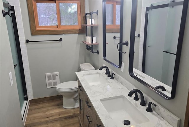 bathroom featuring hardwood / wood-style floors, vanity, and toilet