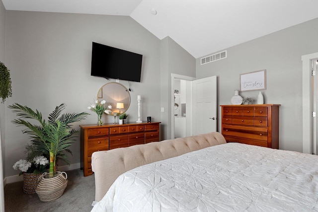 bedroom featuring carpet floors and lofted ceiling