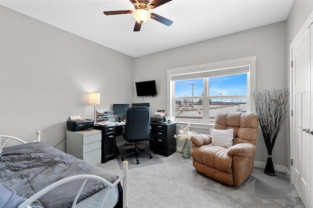 bedroom with ceiling fan and light carpet