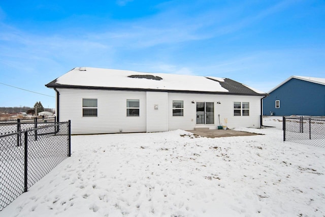 view of snow covered house