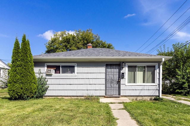 ranch-style house with a front lawn