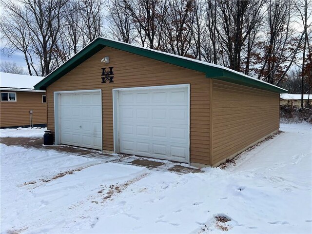 view of snow covered garage