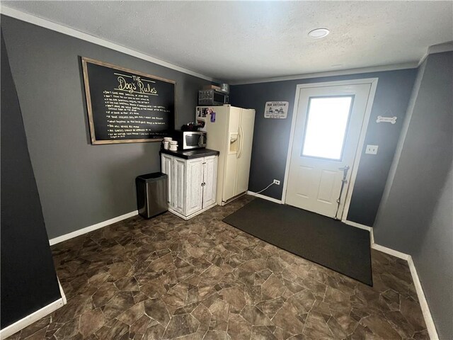 entrance foyer featuring a textured ceiling