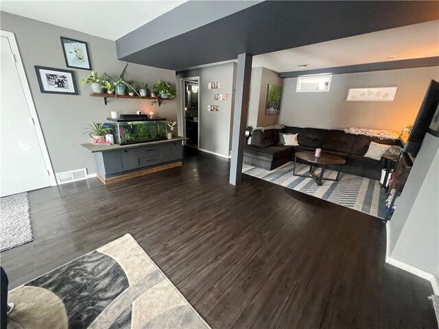 living room with dark hardwood / wood-style flooring