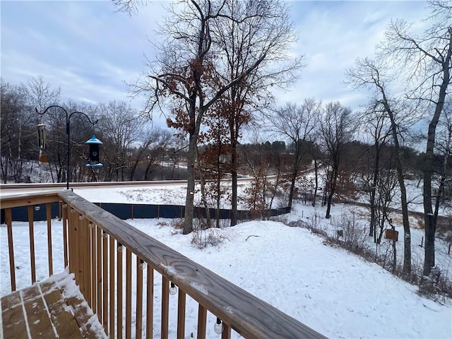 view of snow covered deck