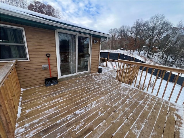 view of snow covered deck