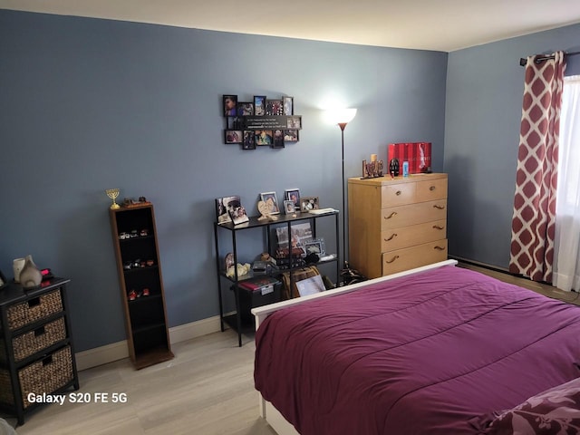 bedroom with wood-type flooring