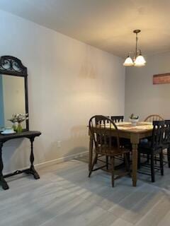 dining space featuring a chandelier