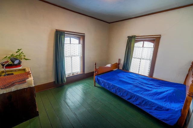 bedroom with wood-type flooring and crown molding