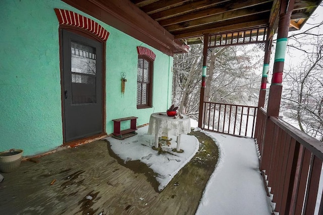 view of snow covered deck