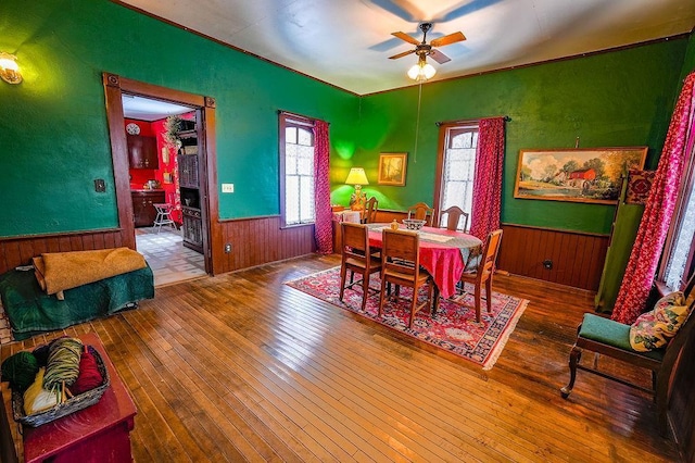 dining area featuring ceiling fan and hardwood / wood-style floors