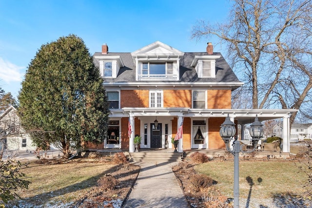 view of front facade with a front yard and a porch