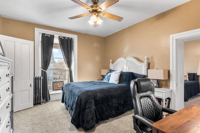 bedroom featuring ceiling fan and light colored carpet