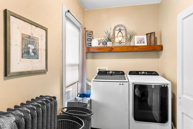 laundry area with washing machine and clothes dryer